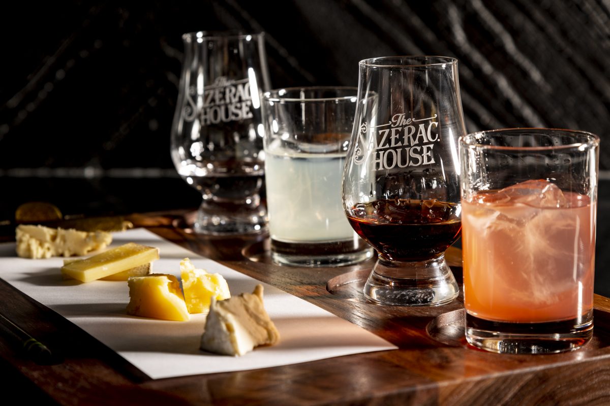 Cheese, Rum, and Cocktails on a wood board