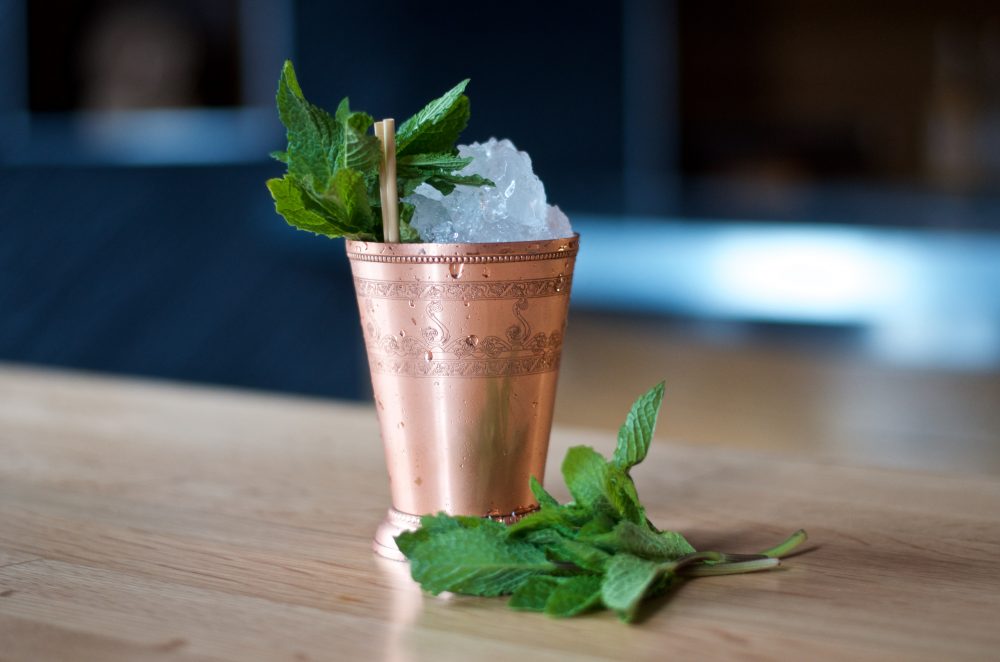 Mint Julep cocktail in copper cup with mint garnish