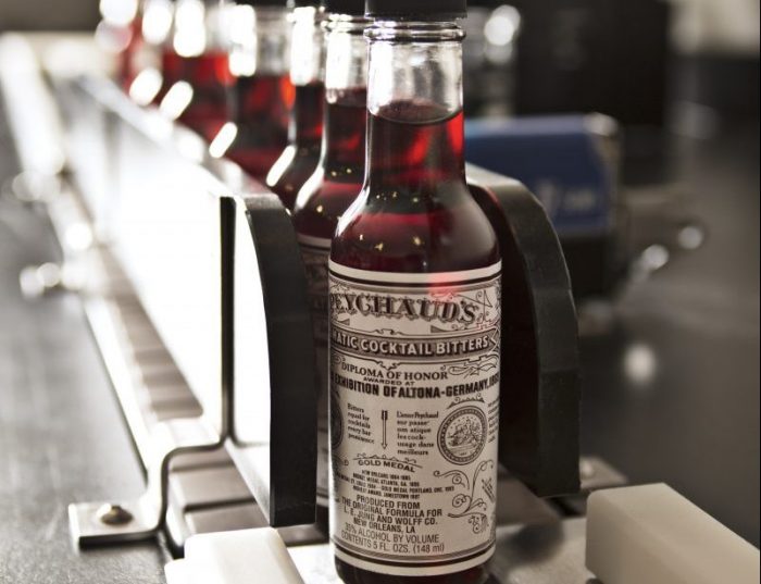 Peychauds bitters bottles on bottling line