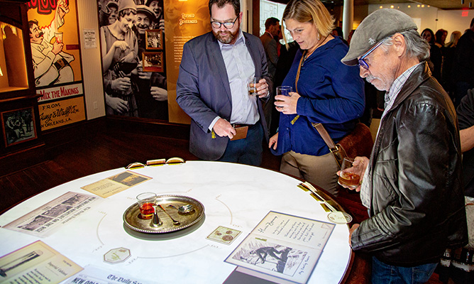 Sazerac House guests interacting with cafe table